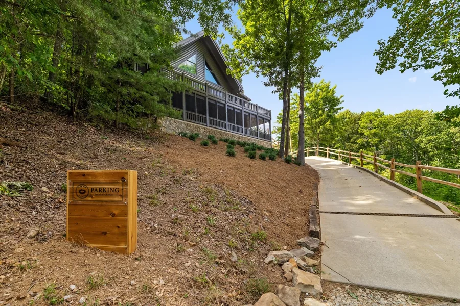 Cedar and glass house seen from the new walkway below