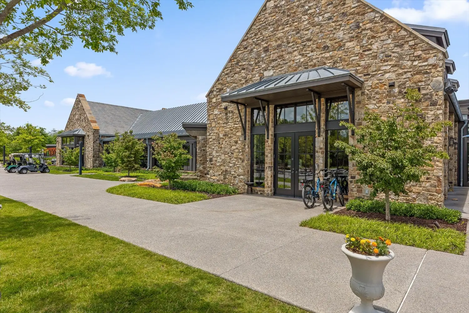 The stone clubhouse at McLemore with glass gables