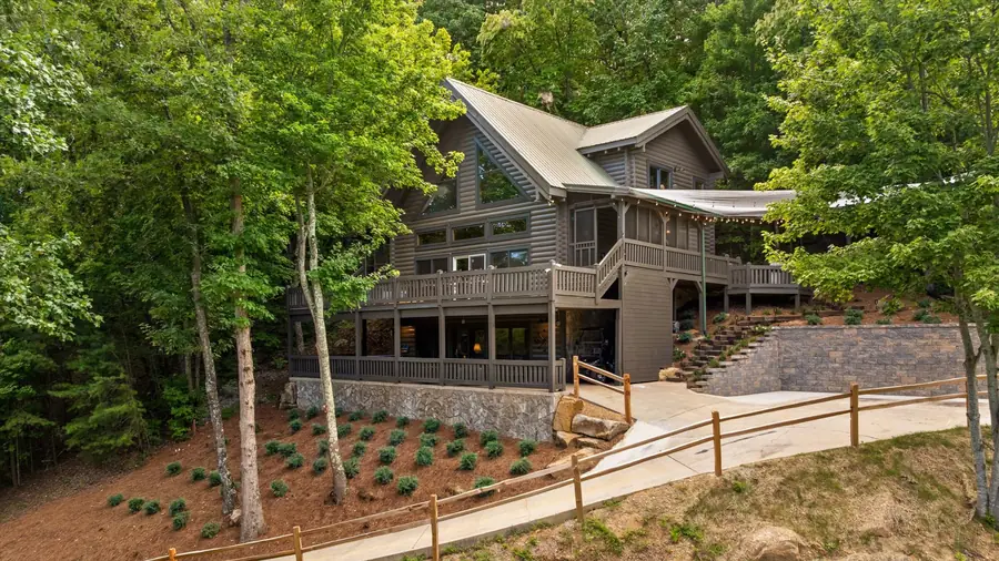 Front of the cedar and stone home from the driveway