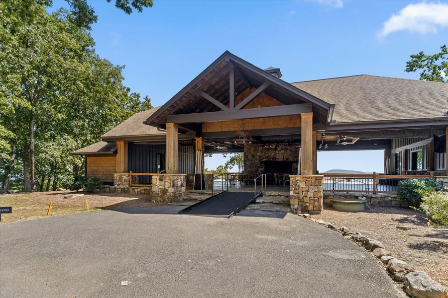 Timber and stone porte cochere at the pavilion entrance
