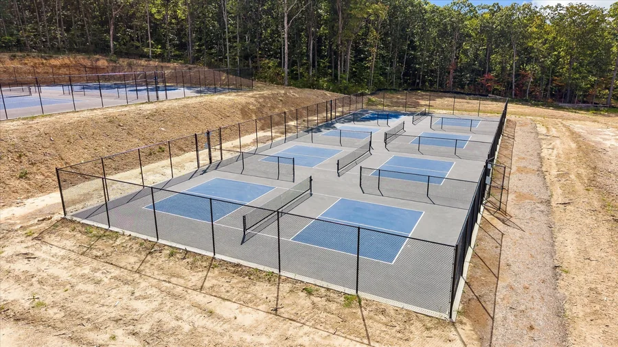 Fenced pickleball courts newly built at West Village