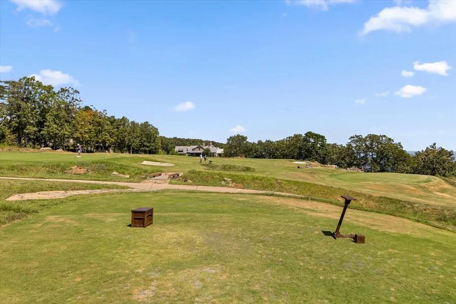 Short course fairway and green cut into open rolling ground
