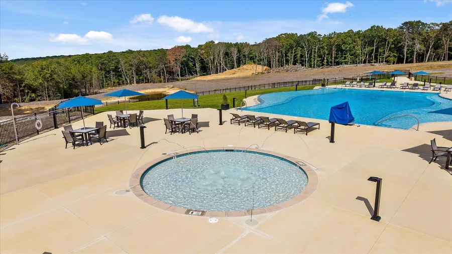 New West Village kid pool with blue loungers along the deck