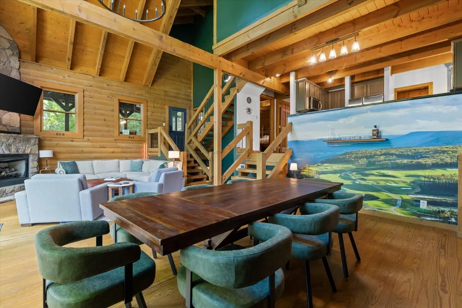 Dining table and Keep mural open to the great room and the log staircase