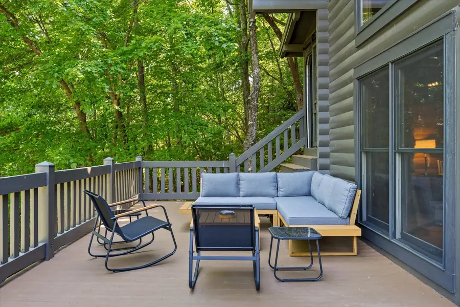 Rocking chairs and lounge seating on a covered porch